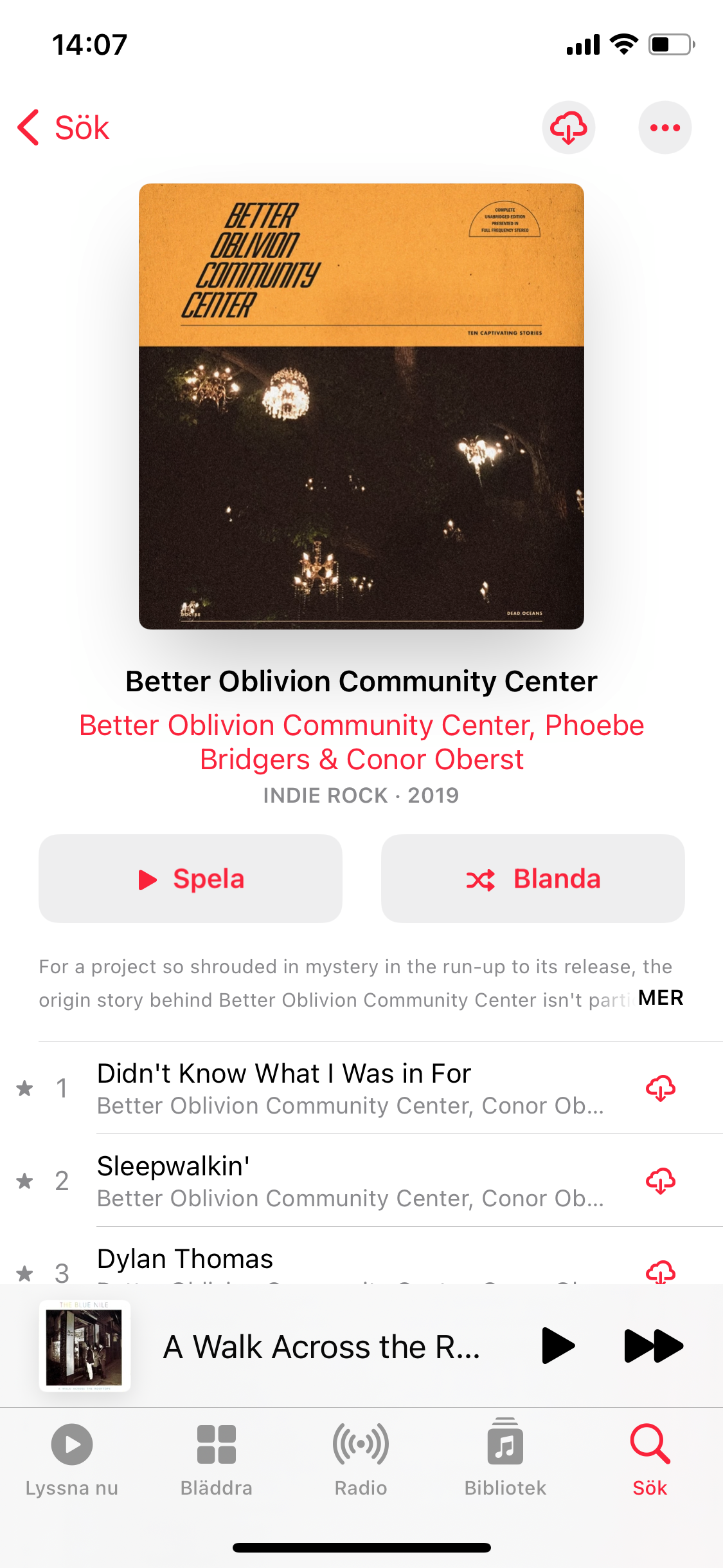 Apple Music album interface with editorial content