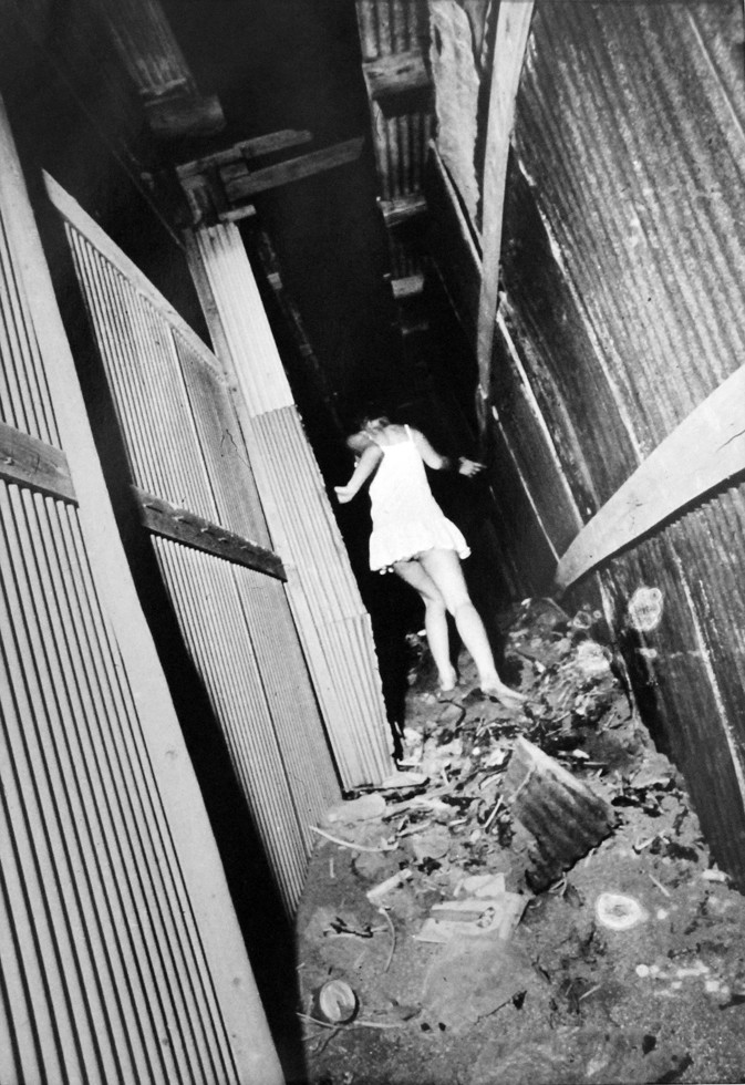 Daido Moriyama - Yokosuka (Woman in White Dress Running), 1971. Gelatin silver print.